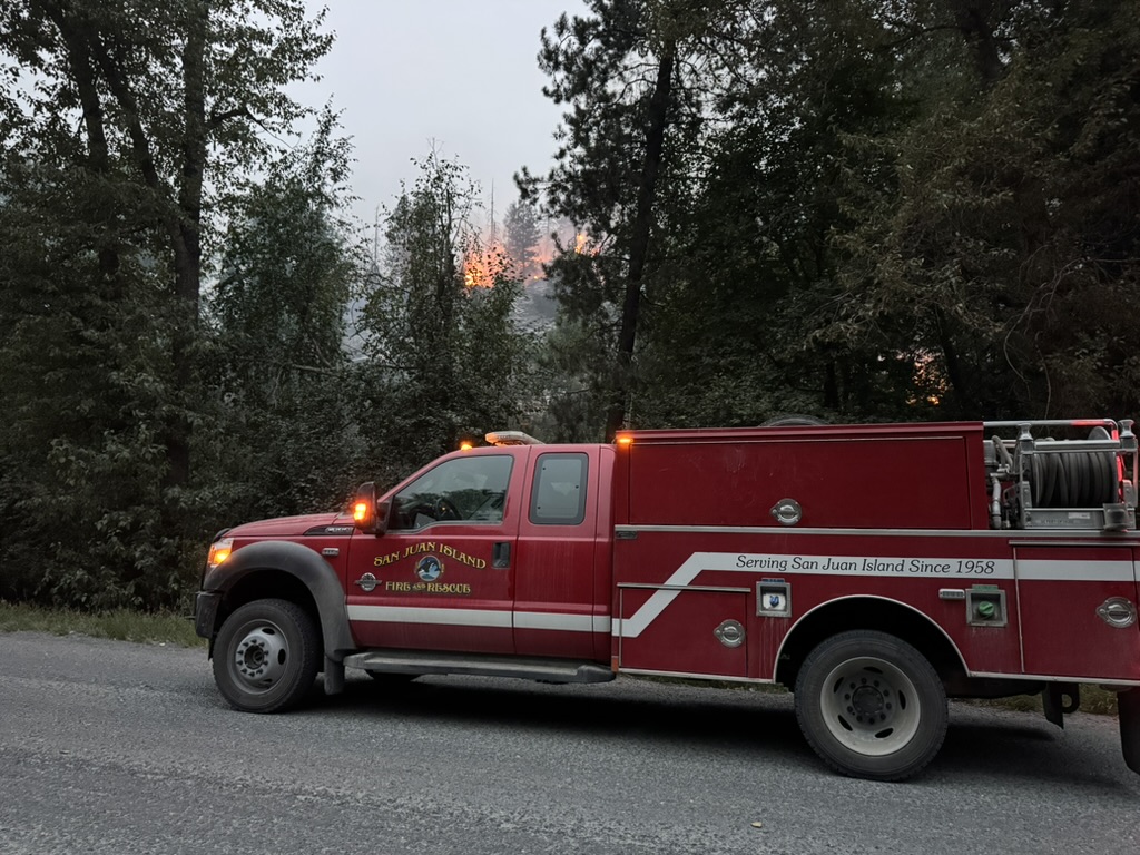 San Juan Island Fire & Rescue engine on the line near an active fire
